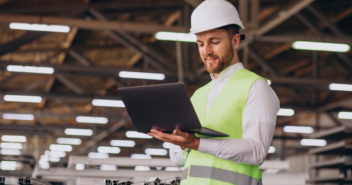 Young man engineer working on factory